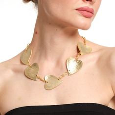 Elevate your accessory game with this stunning Handmade Hammered Gold Heart Statement Necklace from ZeyDor Accessories. Designed for those who love to make a bold statement, this eye-catching necklace features large, hand-hammered heart-shaped pendants that are perfect for any occasion. Whether you're dressing up for a special event or adding a touch of elegance to your everyday outfit, this necklace is a must-have in your jewelry collection. Features: ✦Handcrafted Elegance: Each heart pendant i Metal Double Heart Necklace With Heart Beads, Double Heart Metal Necklace With Heart Beads, Metal Necklaces With Open Heart And Heart Beads, Metal Open Heart Necklaces With Heart Beads, Metal Heart Beads Necklaces For Anniversary, Metal Necklaces With Heart Beads For Anniversary, Heart Shaped Metal Necklace For Valentine's Day, Handmade Metal Necklaces For Valentine's Day, Valentine's Day Heart Metal Necklace