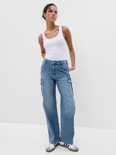 Fit: A full-length loose jean that's fitted on the waist & relaxed all the way down.  Fabric: 99% Organic Cotton, 1% Stretch.  Stretch: Low Stretch Jeans.  Authentic denim with a soft & easy lived-in feel. ​ Rise: Mid Rise Jeans.  Look: A five-pocket jean in a light indigo wash.  Details: Zip fly, five-pocket styling & cargo pockets at sides.  Responsibly Made: This pair of jeans is part of our water-saving Washwell program.  Compared to conventional wash methods, Washwell has saved millions of liters of water since 2016.  Our Mid Rise Jean has a 10" 25 cm) rise. ​ Relaxed through the hip & thigh.  Loose, straight leg. ​ Full-length jean.  Hits below the ankle.  17" 43 cm) leg opening.  Inseam: Petite 27. 5" 70 cm), Short 29" 74 cm), Regular 30" 76 cm), Long 32. 5" 83 cm), Tall 34" 86 cm). Gap Jeans Women, Jeans Look, Jeans Cargo, Jean Trends, Denim Trends, Loose Jeans, Cargo Jeans, Gap Jeans, Mid Rise Jeans