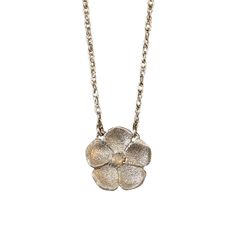 Inspired by a Victorian genre of jewelry, our forget-me-not necklace is handmade in textured metal with a dazzling accent stone in the center. The "name forget-me-not" comes from a German legend of a knight who died trying to obtain these flowers for his lover, calling out with his last breath, "forget me not!" They are therefore known to symbolize true love. Handcrafted in Sterling silver or 14k gold Set with one approx. 2mm stone (opal, ruby, or diamond) Set on a 16" chain, fastened with a sec Metal Jewelry With Flower Charm And Pendant, Silver Necklace With Nature-inspired Flower Charm, Silver Nature-inspired Necklace With Flower Charm, Hand Forged Silver Necklaces In Nature-inspired Style, Hand Forged Silver Nature-inspired Necklace, Hand-forged Silver Nature-inspired Necklace, Nature-inspired Jewelry With Flower Charm For Anniversary, Wedding Necklaces With Flower Charm In Metal, Wedding Necklace With Flower Charm In Metal