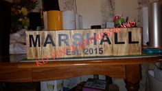 a wooden sign that says marshall wines on it