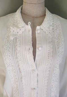 "The best white blouse!  This one has everything! The thick wrinkle resistant semi-sheer chiffon drapes beautifully and is shaped with gentle waist darts and gathering at the shoulder and cuff. No expense spared on adding adornment. Crochet material is laid over the whole collar front and back and generously down the front mixed with meticulous pin-tucks.  Flawless 10/10: no odors, stains, pulls, holes, etc. Comes with original shoulder pads which can be stitched in by you or me upon your reques Tiny Skeleton, Fox Amigurumi, Mouse Crochet, White Collared Blouse, Beaded Cardigan, Crochet Collar, Halloween Bat, Crochet World, Spooky Pumpkin