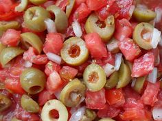 closeup of sliced tomatoes, olives and onions