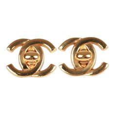 These vintage Chanel earrings of 24K gold plated metal are the iconic CC turn lock with clip on backings. Origin: France Collection: 95ACondition: Vintage; Excellent. Minor scratches. Accompanied by: Chanel box and pouchMeasurements: 1.5" width x 1" height Gold Classic Clip-on Plug Earrings, Designer Gold-tone Earrings For Formal Occasions, Classic Gold Clip-on Earrings With Polished Finish, Classic Yellow Gold Earrings With Logo Plaque, Designer Gold Earrings With Polished Finish, Designer Gold Tarnish Resistant Earrings, Classic Metal Clip-on Earrings, Designer Tarnish Resistant Gold Earrings, Elegant Yellow Gold Earrings With Gold-tone Logo