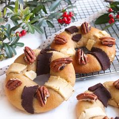 a bundt cake with pecans and chocolate on top