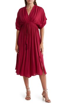 Slip into style with this puffed sleeve midi dress that exudes effortless attitude. 45" length (size S) V-neck Short puff sleeves Tied waistline 100% rayon Hand wash Imported Model stats: 5'10" height, 32" bust, 25" waist, 36" hip. Model is wearing size S. Chic Knee-length Flowy Puff Sleeve Dress, Spring Midi Dress With Pleated Flutter Sleeves, Summer Midi Dress With Flutter Pleated Sleeves, Summer Midi Dress With Pleated Flutter Sleeves, Solid Color Flowy Midi Dress With Flutter Sleeves, Flutter Sleeve Midi Dress For Brunch, Solid Color Midi Dress With Flutter Sleeves For Brunch, Casual Flutter Sleeve Midi Dress For Fall, Billowy Midi Dress For Daywear