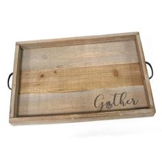 Makeyourhomemoreinvitingwiththehandcrafted"Gather"WoodTray.Thedistressedwoodfinishgivesthedesignarusticqualityyetthemetalsidehandlesaddacontemporarytouchmakingitblendeasilywithallinteriorsfromtraditionaltomodern.Imprintedinblackistheword"Gather"thatissuretomakeguestsfeelwelcome.Useitasadecorativeaccentorgetimaginativeandcreateawonderfuldisplayforspecialoccasions.Thisstylishtraymeasures18"Lx12"Wx1.75"Handwilllookgreatonyourcoffeetablecredenzaorkitchencounter.Int Wood Coffee Table Tray, Tray Table Decor, Coffee Table Tray, Serving Tray Wood, Diy Holz, Tabletop Accessories, Ottoman In Living Room, Metal Trays, Distressed Wood