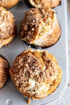 several muffins sitting on top of a baking pan