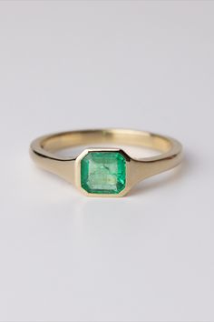 Blaise features a vibrant emerald (0.66ct) framed by a finely crafted recycled solid gold bezel setting. This one-of-a-kind ring is mindfully handmade in our London studio, with a responsibly sourced gemstone. Grey Diamond Engagement Ring, Christmas Proposal, Christmas Jewellery, Bespoke Engagement Ring, Jewellery Gifts, Dream Engagement, Dream Engagement Rings, Emerald Engagement, Grey Diamond