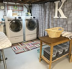 a washer and dryer in a laundry room with rugs on the floor