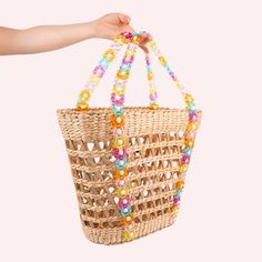 The cutest beaded beach tote is *almost* here. This woven natural straw beach tote is embellished with a unique multicolor beaded top handle. The interior basket is reinforced with sturdy boning so you can carry all of your beach & summertime essentials! PREORDER NOW! These will ship the estimated beginning of August 2024. Dimensions: 18" L x 6" W x 12" H Top handle drop: 7.5" (Top handle carry. This is NOT a shoulder bag.) Everyday Use Beaded Rectangular Beach Bag, Summer Vacation Beaded Beach Bag, Spring Beach Bags With Beaded Details, Summer Beach Beaded Straw Bag, Summer Multicolor Beaded Bag, Straw Beach Tote, Scarf Coverup, Rebecca Black, Beach Basket