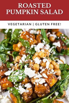 roasted pumpkin salad on a plate with feta cheese and spinach leaves in the background