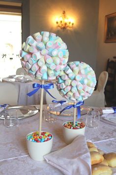 there are two candy lollipops on top of each other at the table