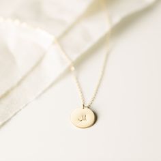 One of our most personalizable pieces. Add an inscription or illustration (and maybe some extra tags) to make it yours. Minimalist Moon Charm Round Disc Jewelry, Minimalist Stamped Necklaces With Initial Pendant, Minimalist Monogram Pendant Jewelry, Minimalist Stamped Initial Pendant Necklace, Personalized Yellow Gold Moon Jewelry, Simple Engraved Initial Pendant Jewelry, Elegant Hand Stamped Initial Necklace With Round Pendant, Elegant Hand Stamped Medallion Jewelry, Tell Your Story