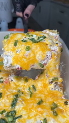 a close up of a plate of food with broccoli and cheese