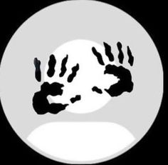 an animal's paw is shown in front of a white circle with the moon behind it