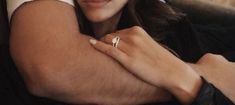 a close up of a person wearing a ring