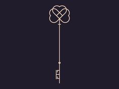 a key with two intertwined hearts hanging from it's end on a black background