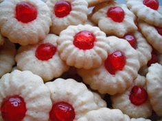 some cookies with red and white toppings on them