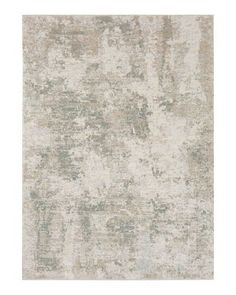 an area rug with grey and white colors