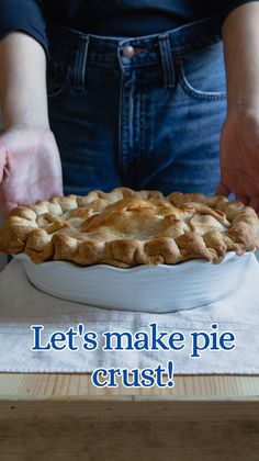 a pie with the words let's make pie crust on it, and someone holding out their hands