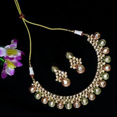 Exotic and snag-free kundan beaded necklace set with earrings. This is a stylish set with White Kundan. This set will work well with traditional, formal, and western formals. Eye-catching and unique jewelry that will set you apart. Gift this piece to a loved one, and see their face light up with joy. Best for gifting or for personal use, wear it to any occasion and become the spotlight. Option 1 : White (D536) Option 2 : Red & Green (D537) Necklace Set With Earrings, Saree Jewellery, Silver Pooja Items, Glass Bangles, Silver Toe Rings, Gold Chain With Pendant, Kundan Necklace, Kundan Earrings, Ruby Necklace