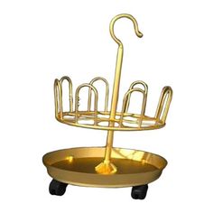 a gold plate with an umbrella on it and some bars attached to the top rack