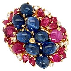 Simply Beautiful! Finely detailed Gold Cocktail Cluster Ring. Hand set with Sapphires, Rubies, weighing approx. 7.26tcw and Round Brilliant-Cut Diamonds, approx. 0.26tcw. Ring size 6; we offer ring re-sizing. Measures approx. 1.04” L 0.86” W x 0.84” H. Hand crafted in 18 Karat Yellow Gold. The ring is in excellent condition and was recently professionally cleaned and polished. More Beautiful in Real time! Sure to be admired Family Heirloom Quality Keepsake, to have and to hold Forever! To Have And To Hold, Vintage Sapphire, Ring Hand, Gold Cocktail, Vintage Cocktail, Ruby Diamond, Cluster Ring, Round Brilliant Cut Diamond, Simply Beautiful