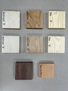 four different types of wood are shown on the table with numbers and words in them