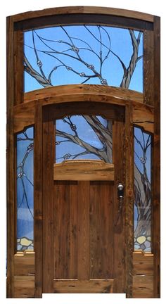 a wooden door with stained glass in the front and side panels on it's sides