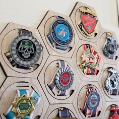 a wooden hexagonal display with many medals on it