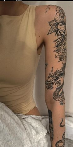 a woman with a tattoo on her arm