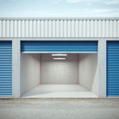 an empty storage unit with blue doors