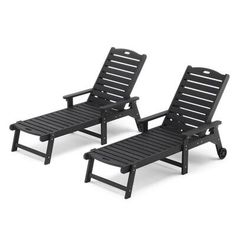 two black lounge chairs sitting next to each other