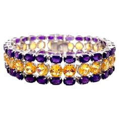 Beautifully handcrafted 44.80 Carat Amethyst and Citrine Gemstone Wide Bracelet, designed with love, including handpicked luxury gemstones for each designer piece. Grab the spotlight with this exquisitely crafted piece. Inlaid with natural amethyst and citrine gemstones, this bracelet is ideal for anyone's wish list--especially if it's your birthstone! Amethyst helps to relieve stress and anxiety in your life and citrine has strong vibration energy which helps promotes mental clarity. This is a Vibration Energy, American Art Deco, Amethyst And Citrine, Retro Bracelet, Mother Daughter Gifts, Wide Bracelet, Exclusive Jewelry, Citrine Gemstone, Mental Clarity