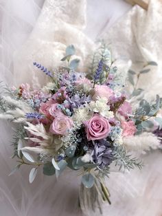 a bridal bouquet with pink and white flowers