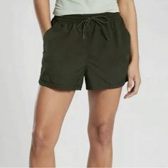 Athleta Expedition Short - New With Tags Semi-Fitted Hiking Short In Olive Green. The Mid-Rise Waistband Holds You In For All Activities. Soft Fabric Is A Lightweight Recycled Nylon That Dries Quickly. Waistband Has A Drawstring For Easy Adjustability And Easy On/Off. Size 4 Lightweight Fabric 2 Inch Inseam Side Pockets 100% Nylon Brand New, Never Worn With Tags. Casual Green Activewear For Beach, Casual Green Activewear For The Beach, Casual Breathable Activewear For Beach, Athletic Swim, Coral Shorts, Athleta Shorts, Black Athletic Shorts, Hiking Shorts, Camo Shorts