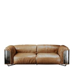 a brown leather couch sitting on top of a white floor next to a metal frame