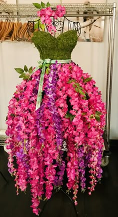 a dress made out of pink and purple flowers