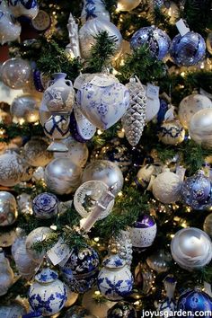 a christmas tree decorated with blue and white ornaments