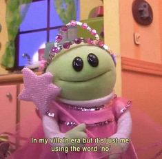 the frog is wearing a tiara and holding a star in her hand with a caption that reads, i'm my villain era but it's just me using the word no