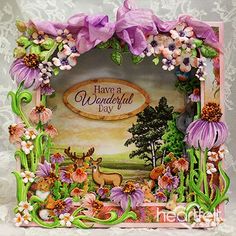 there is a card with flowers and deer on the front, it says have a wonderful day