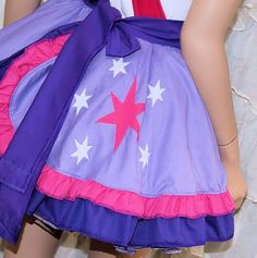 a close up of a mannequin wearing a dress with white stars on it