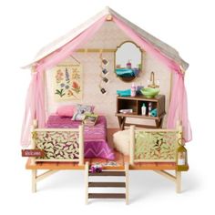 a doll house with furniture and accessories in it