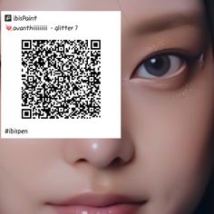 a close up of a person's face with a qr code on their forehead