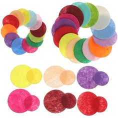 a bunch of different colored discs on a white background