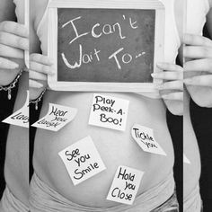 a pregnant woman holding a sign that says i can't wait to do something