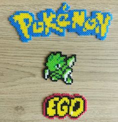 some pixel art pieces on a wooden surface