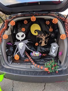 the trunk of a car decorated for halloween