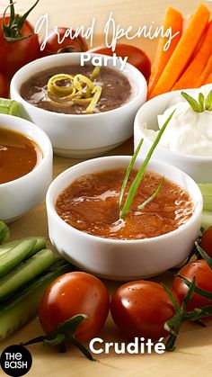 several different types of dips and vegetables on a cutting board with tomatoes, celery, cucumbers, carrots, sour cream