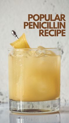 a close up of a drink in a glass on a table with the words popular penguinin recipe above it